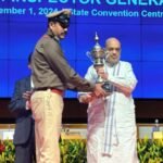 Union Home Minister Amit Shah presenting the Best Police Station Award to Nimiyaghat Station In-charge Rana Jung Bahadur in Bhubaneswar, 2024.