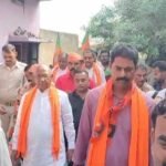 Saryu Roy, JDU candidate, engaging with voters during his campaign tour in Jamshedpur.