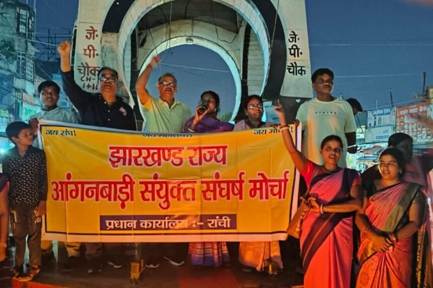 Anganwadi Sevikas and Sahayikas in Jharkhand holding a torchlight procession ahead of their indefinite strike in 2024