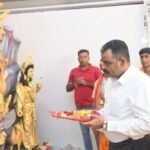 CCL CMD Nilendu Kumar Singh inaugurates the Durga Puja pandal in Gandhinagar, surrounded by community members and CCL officials