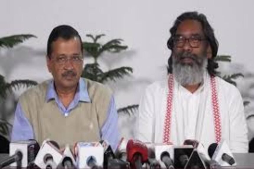 Arvind Kejriwal and Hemant Soren during a press conference in Delhi, confirming attendance at Jharkhand's oath ceremony.