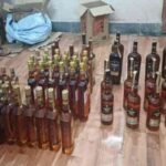 Police in Baharagora arrest two individuals for possession of illegal liquor during a routine vehicle check.