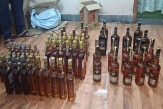 Police in Baharagora arrest two individuals for possession of illegal liquor during a routine vehicle check.