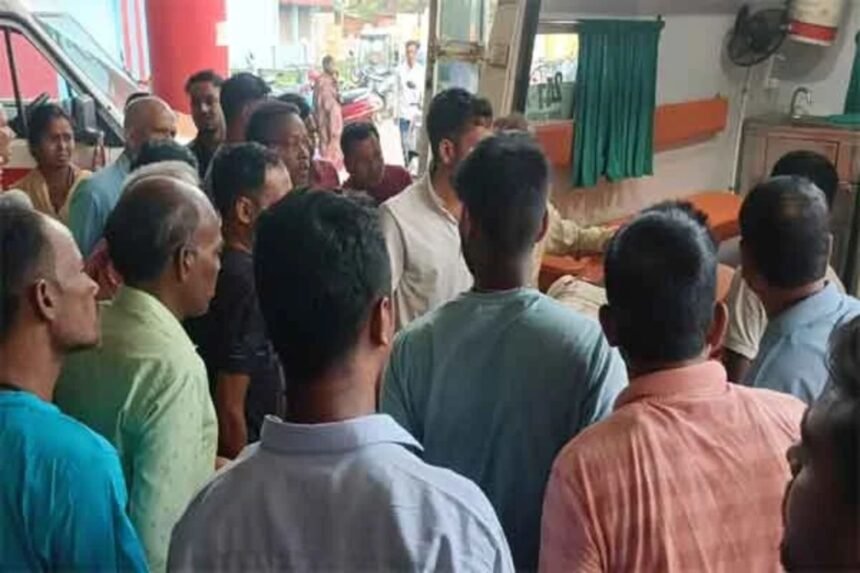 Image of an iron rod and a police officer at the scene of the attack in Chaibasa.