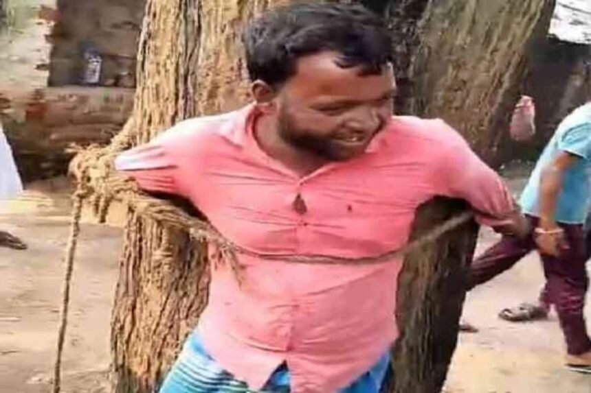 Villagers tie a harassment suspect to a tree in Dhanbad after allegations of assaulting a young woman.