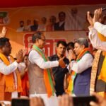 Dinesh William Marandi, former JMM MLA, joining BJP in the presence of Shivraj Singh Chouhan during a public event in Littipara.