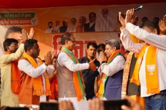 Dinesh William Marandi, former JMM MLA, joining BJP in the presence of Shivraj Singh Chouhan during a public event in Littipara.