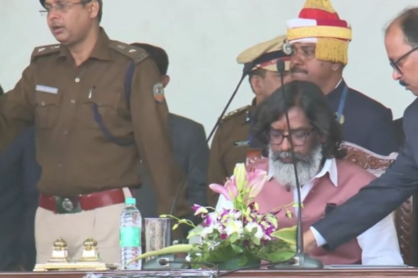 Hemant Soren taking oath as Jharkhand Chief Minister at Morahbadi Ground, with prominent leaders like Rahul Gandhi and Mallikarjun Kharge in attendance.