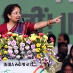 Kalpana Soren speaking at a Jharkhand election rally with a large gathering of supporters