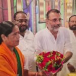 Nishikant Dubey speaking at the Ghatwar community conference in Gandey, advocating for BJP candidate Munia Devi.