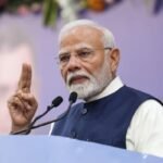 PM Modi addressing supporters during his roadshow in Ranchi on November 10, with heavy security presence