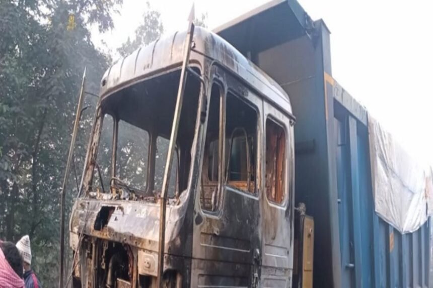 Burnt coal transport truck set ablaze by militants near Bachra Stadium in Piparwar, disrupting NTPC logistics.