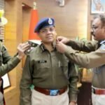 Sunil Bhaskar being honored by DGP Anurag Gupta with the IG badge during a formal ceremony in Jharkhand.