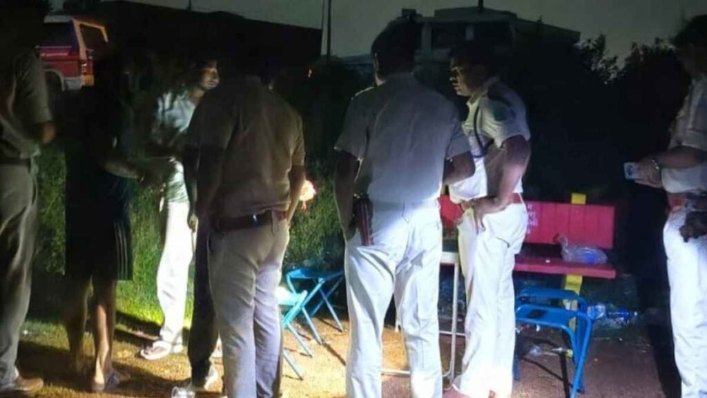 Police personnel conduct a nighttime check near a public area in Ranchi