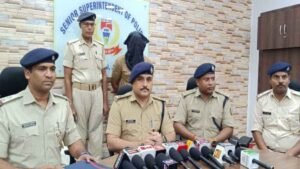 Police seize packets of ganja from a car during a vehicle check in Baharagora