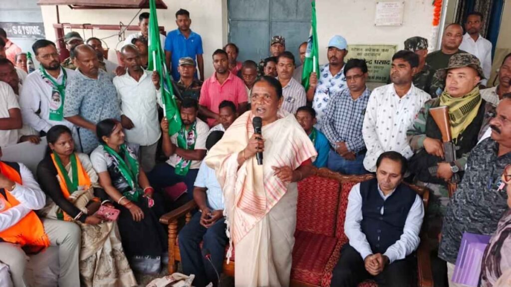 Woman addresses a gathering at Manoharpur railway station during a train welcome event